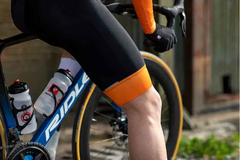 BCF Performance Long Cut Bib Short in Black/Orange-6